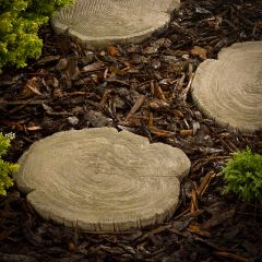 log stepping stones surrounded by bark